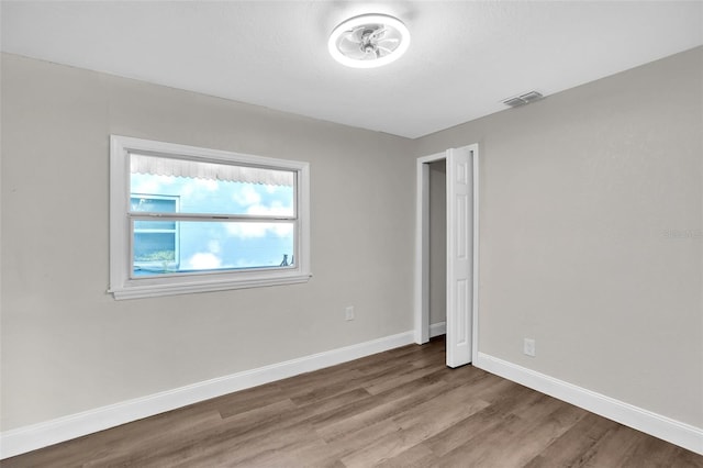 unfurnished bedroom with hardwood / wood-style floors