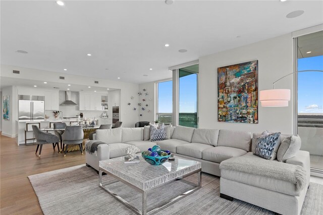 living room with light hardwood / wood-style flooring