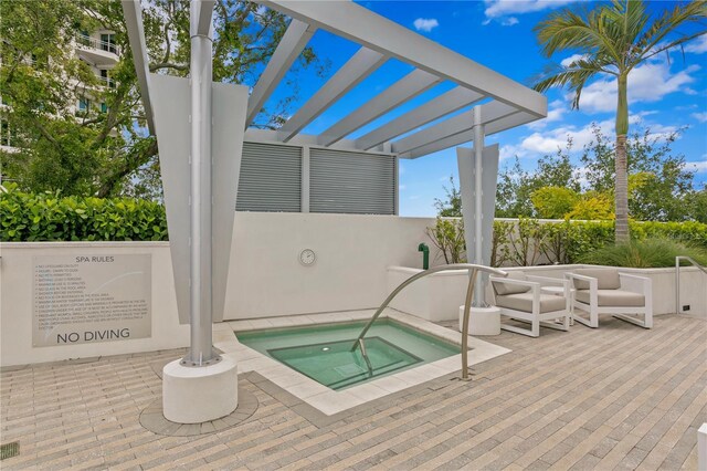 view of pool featuring a community hot tub and a pergola