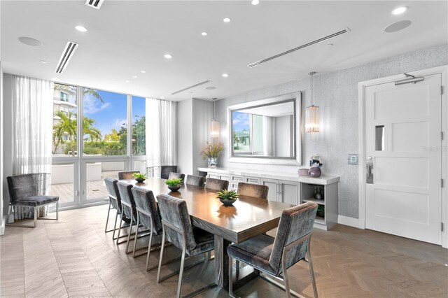 dining room with parquet flooring