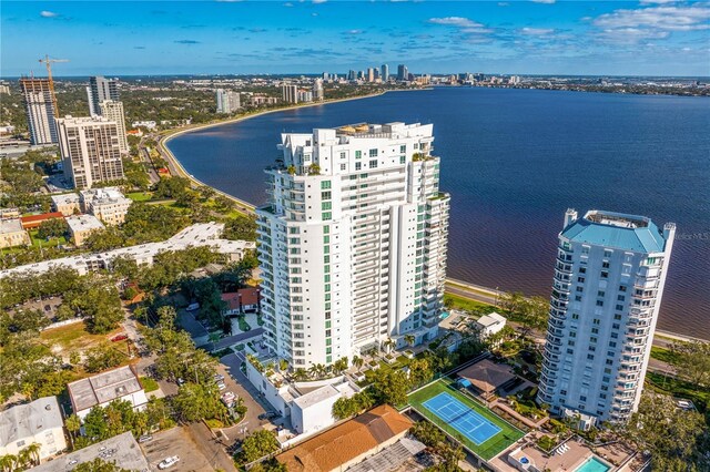 birds eye view of property with a water view