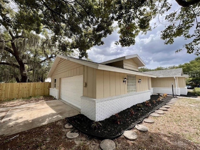 view of property exterior featuring a garage