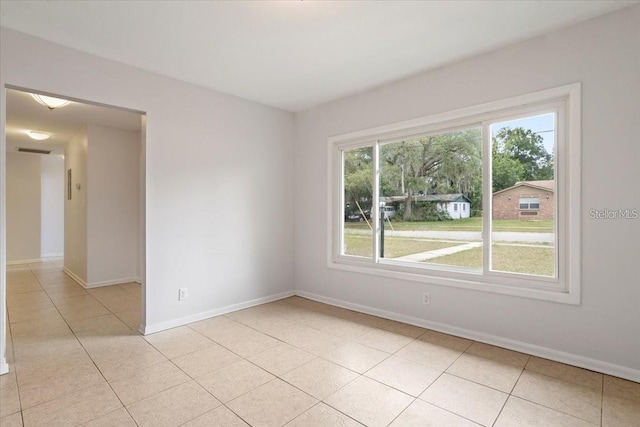 spare room with light tile patterned floors