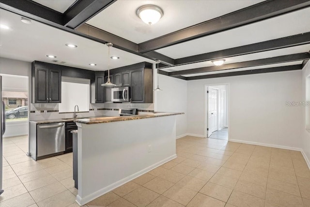 kitchen featuring light stone counters, stainless steel appliances, sink, beam ceiling, and light tile patterned floors