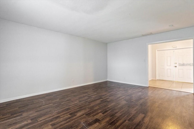 unfurnished room featuring hardwood / wood-style floors