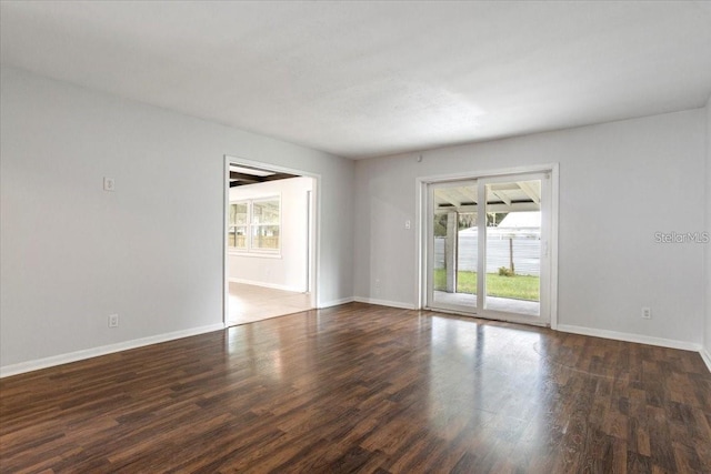 empty room featuring dark wood-type flooring