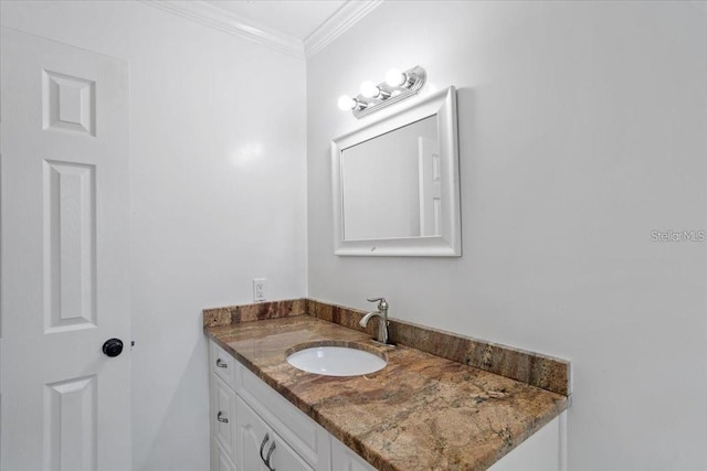 bathroom with vanity and crown molding