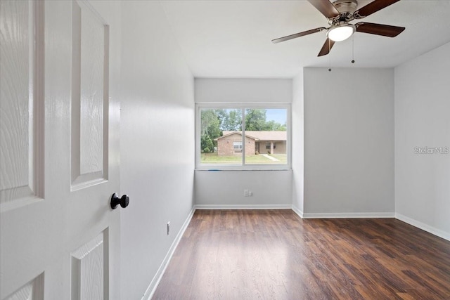 unfurnished room featuring ceiling fan and dark hardwood / wood-style floors