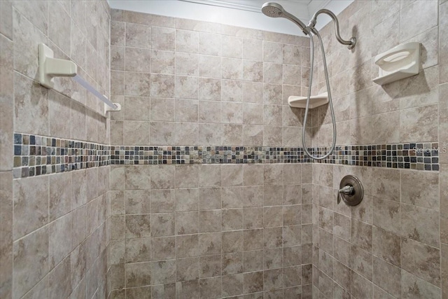 bathroom featuring tiled shower