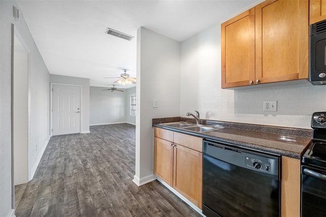 kitchen with dark hardwood / wood-style flooring, dark stone counters, ceiling fan, sink, and black appliances