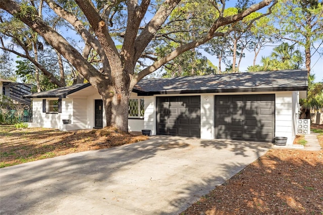 single story home featuring a garage