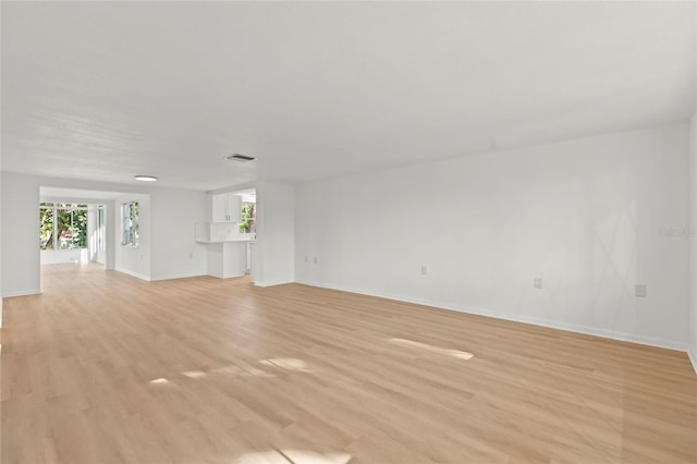 unfurnished living room featuring light hardwood / wood-style flooring