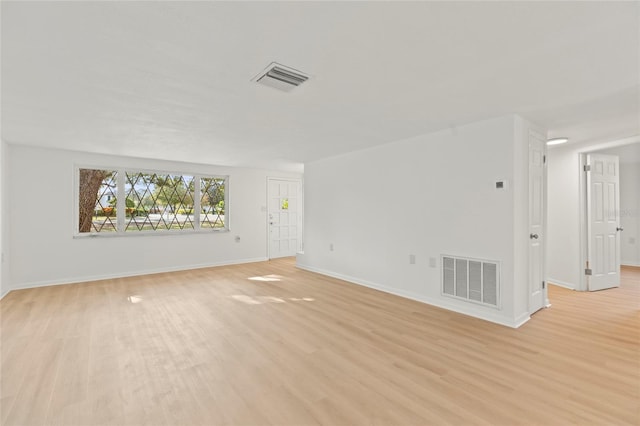 spare room with light wood-type flooring