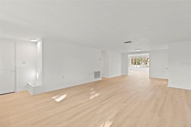 unfurnished room with light hardwood / wood-style floors