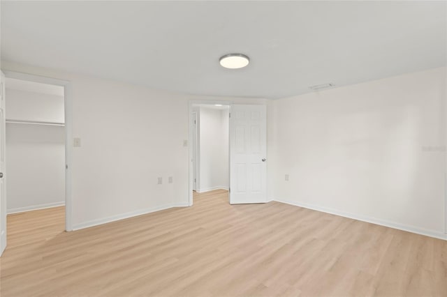 spare room featuring light hardwood / wood-style flooring