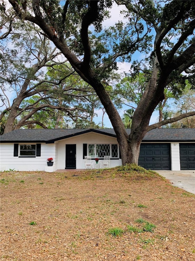 ranch-style house featuring a garage