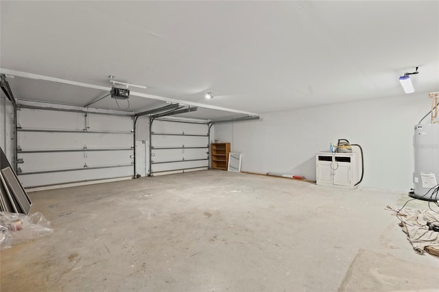 garage with a garage door opener and water heater