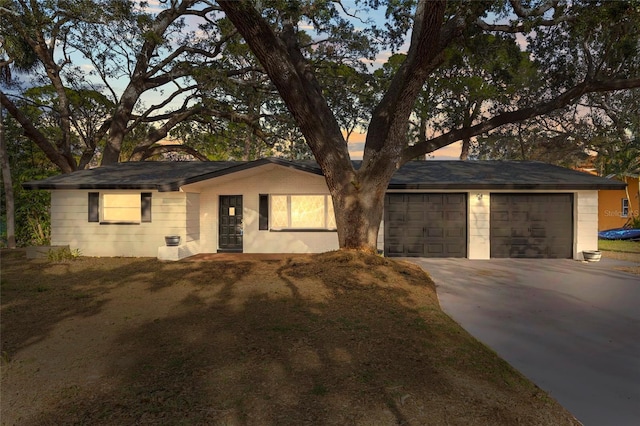 single story home with a garage