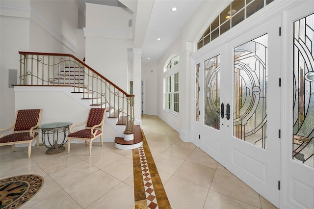 119 8th St E, Tierra Verde, FL 33715 - entryway with stairway, recessed lighting, tile patterned floors, and inlaid floor details