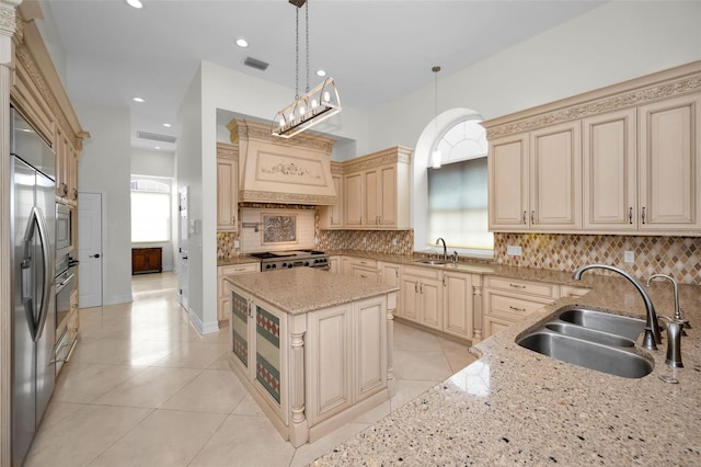 119 8th St E, Tierra Verde, FL 33715 - kitchen with cream cabinets, custom exhaust hood, tasteful backsplash, and recessed lighting