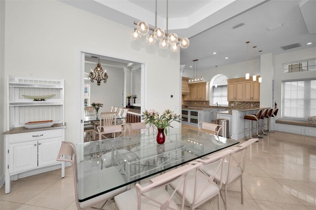 119 8th St E, Tierra Verde, FL 33715 - dining room featuring a chandelier, light tile patterned floors, and recessed lighting