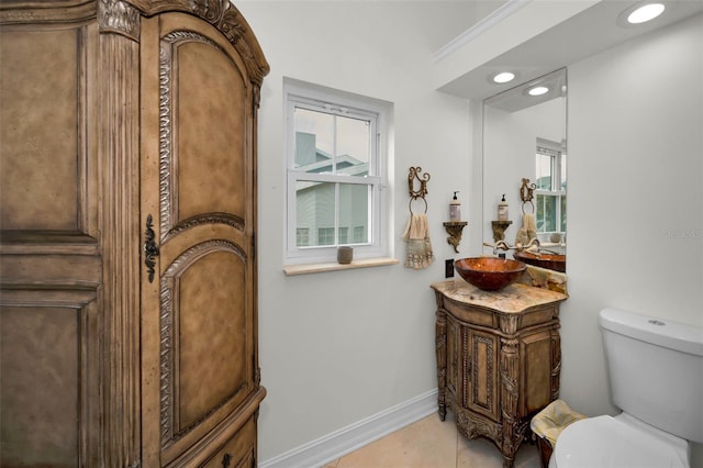 119 8th St E, Tierra Verde, FL 33715 - half bathroom featuring vanity, healthy amount of natural light, recessed lighting, and tile patterned flooring