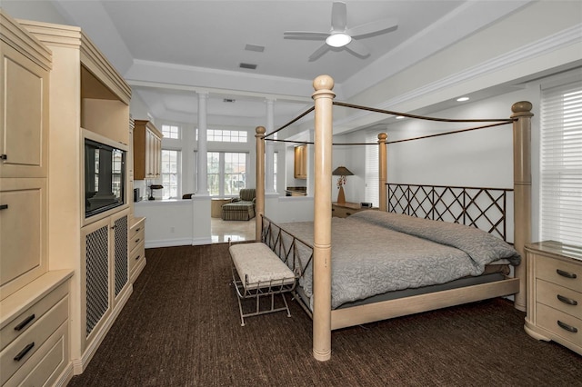 119 8th St E, Tierra Verde, FL 33715 - bedroom featuring dark colored carpet and decorative columns