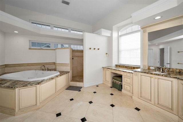 bathroom featuring tile patterned flooring, vanity, and independent shower and bath