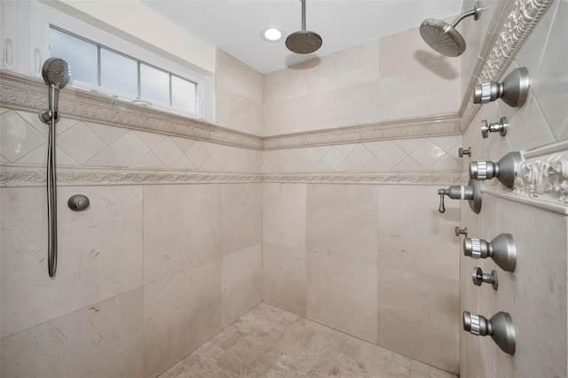 bathroom with a tile shower