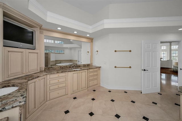 119 8th St E, Tierra Verde, FL 33715 - full bathroom with double vanity, tile patterned floors, recessed lighting, a bathtub, and crown molding