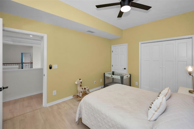119 8th St E, Tierra Verde, FL 33715 - bedroom featuring wood finished floors, a closet, and a ceiling fan