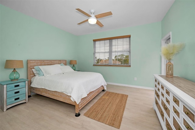 bedroom with ceiling fan and light wood-type flooring