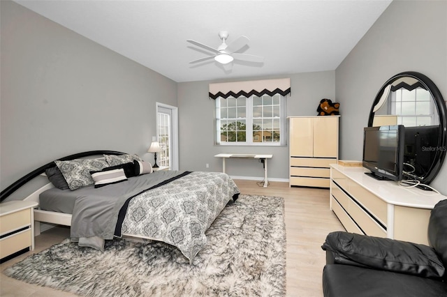 119 8th St E, Tierra Verde, FL 33715 - bedroom featuring multiple windows, light wood finished floors, and ceiling fan
