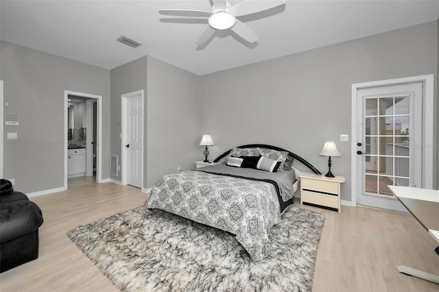 119 8th St E, Tierra Verde, FL 33715 - bedroom featuring wood finished floors, ceiling fan, connected bathroom, and access to exterior