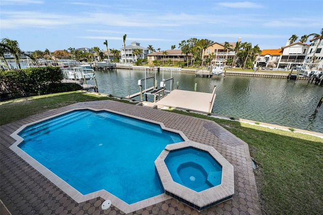 view of swimming pool with an in ground hot tub, a boat dock, and a water view