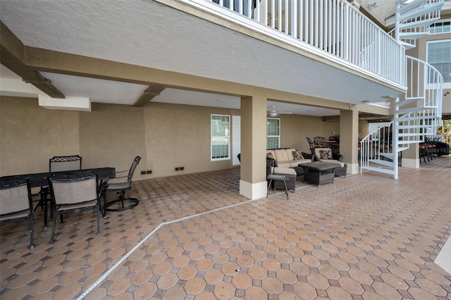 119 8th St E, Tierra Verde, FL 33715 - view of patio featuring stairs, an outdoor living space, and outdoor dining area