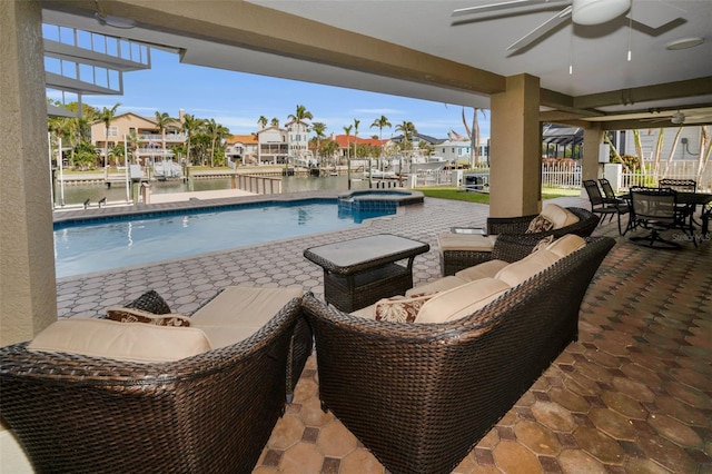 119 8th St E, Tierra Verde, FL 33715 - view of swimming pool featuring a ceiling fan, a patio, outdoor dining area, and outdoor lounge area