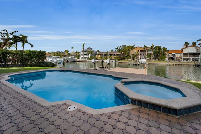 view of pool featuring a water view, an in ground hot tub, and a dock