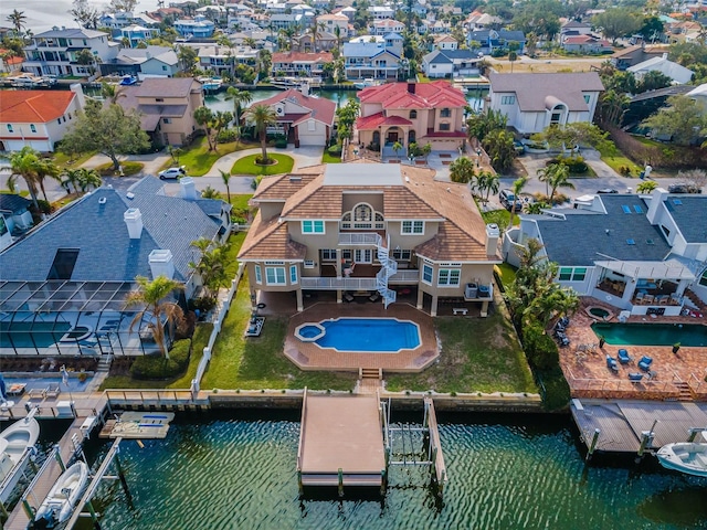 119 8th St E, Tierra Verde, FL 33715 - aerial view of residential area with a large body of water