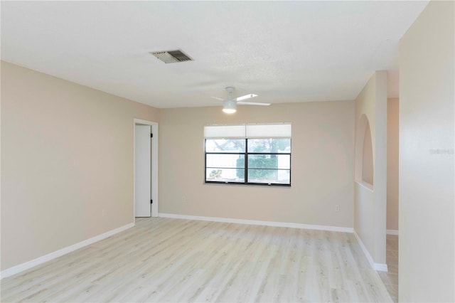 unfurnished room with ceiling fan and light hardwood / wood-style flooring