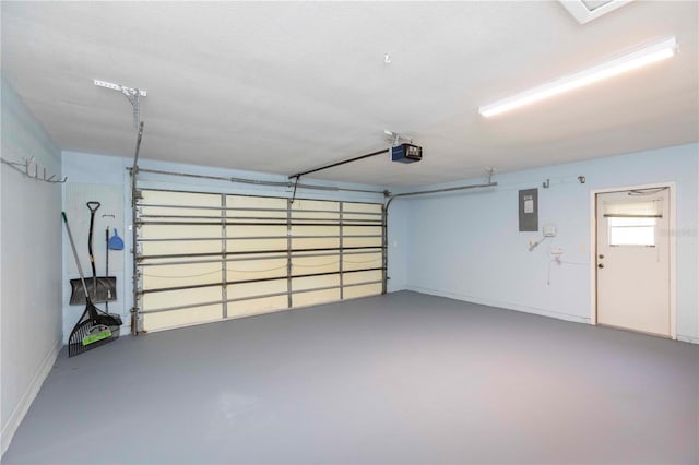 garage featuring electric panel and a garage door opener