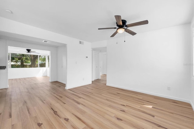 spare room featuring ceiling fan and light hardwood / wood-style floors