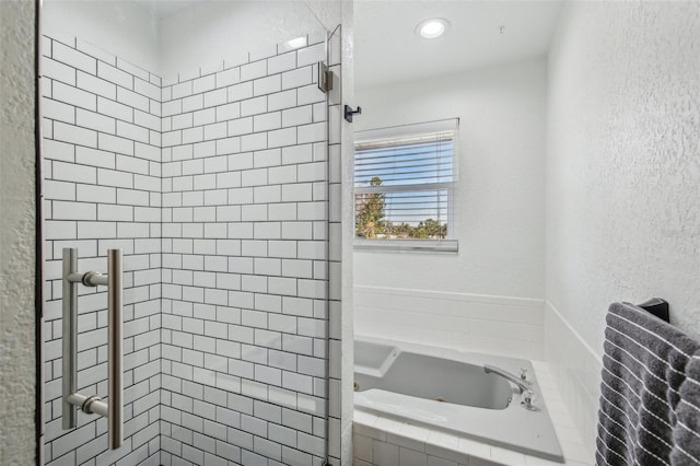 bathroom featuring separate shower and tub