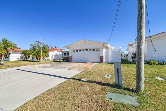 ranch-style home with a garage and a front yard