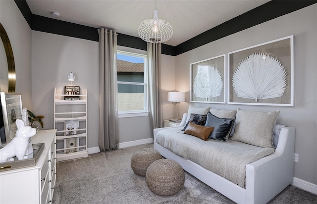 bedroom featuring carpet flooring and a notable chandelier