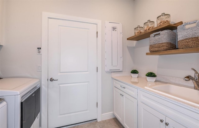 laundry room featuring washer / dryer, cabinets, light tile patterned floors, and sink