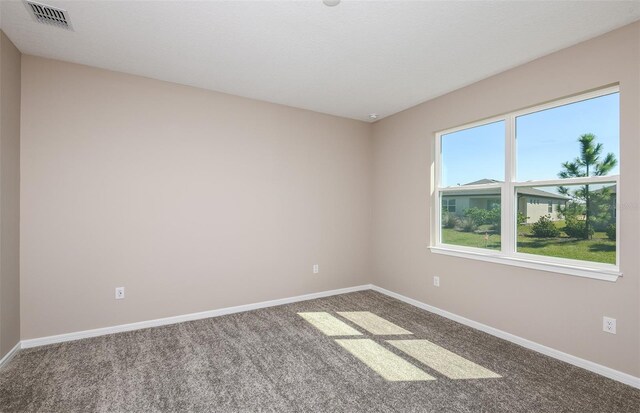 unfurnished room with carpet floors