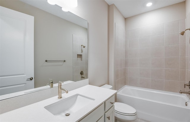 full bathroom with vanity, toilet, and tiled shower / bath