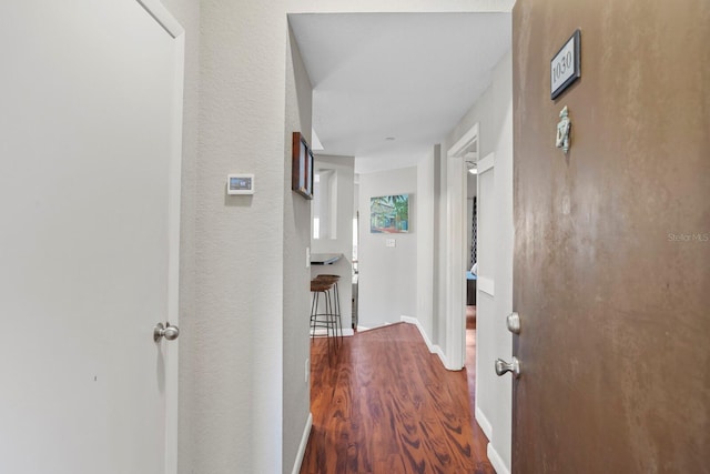 hallway featuring hardwood / wood-style flooring