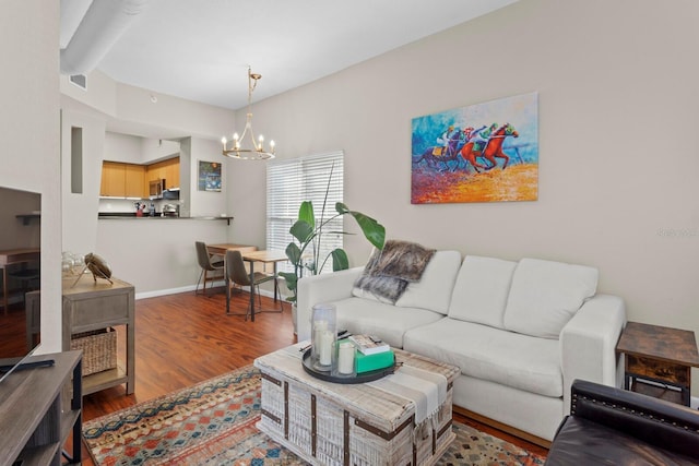 living room featuring hardwood / wood-style floors and a chandelier